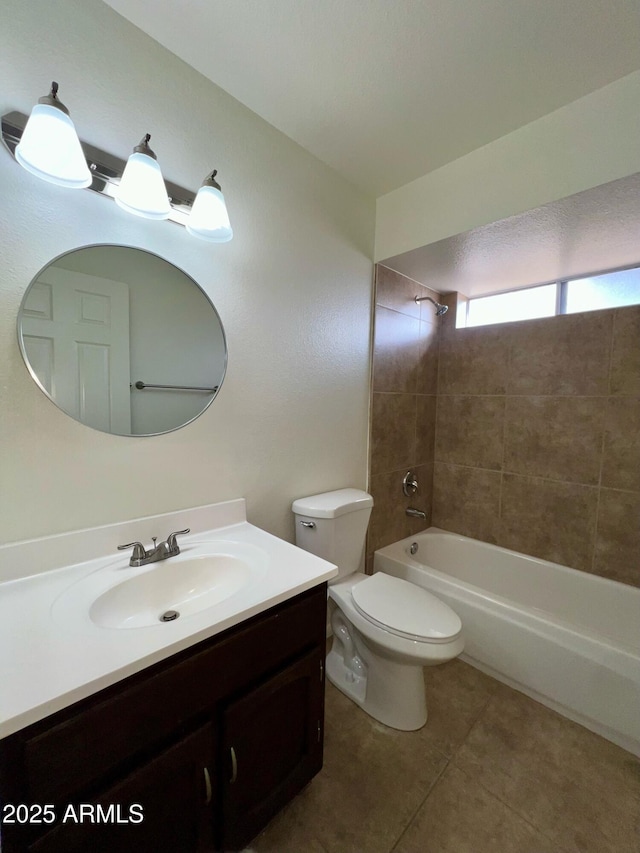 full bath featuring tile patterned floors, shower / bathtub combination, toilet, and vanity