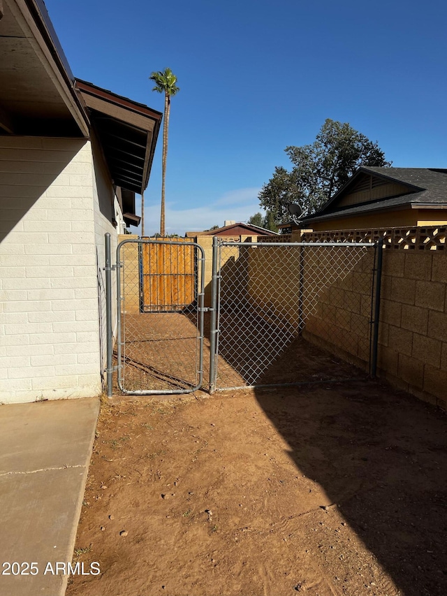 view of yard with a gate and fence