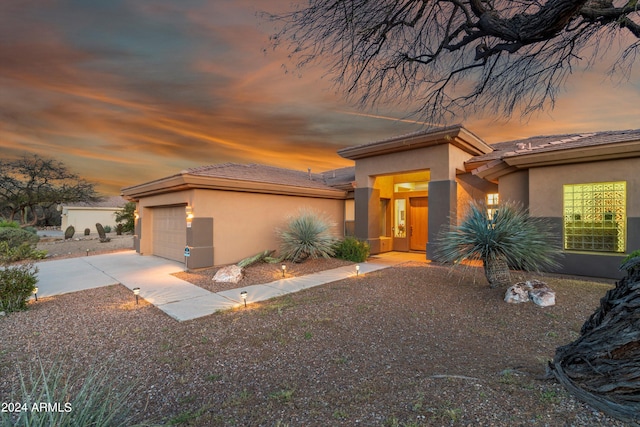 prairie-style home featuring a garage