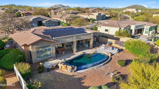 view of pool with a patio area and a mountain view