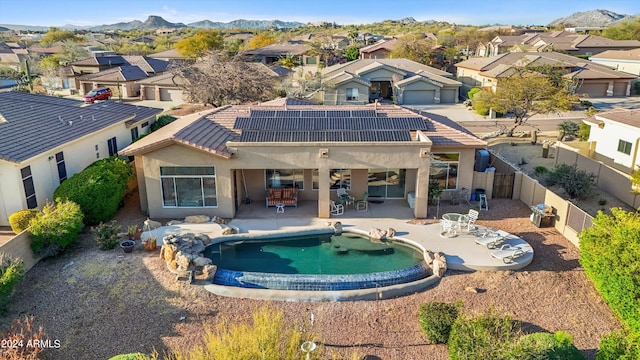 view of swimming pool featuring a patio area and a mountain view