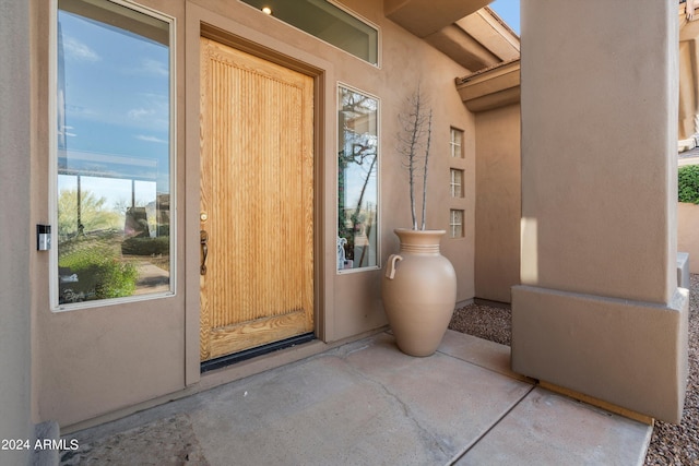 doorway to property featuring a patio