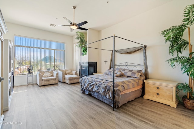 bedroom featuring ceiling fan and light wood-type flooring