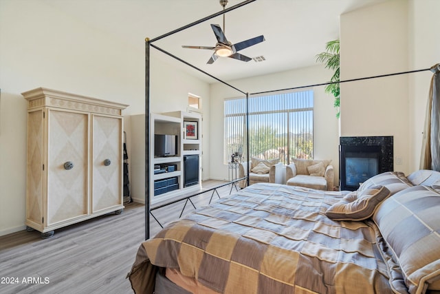 bedroom featuring ceiling fan and light hardwood / wood-style flooring