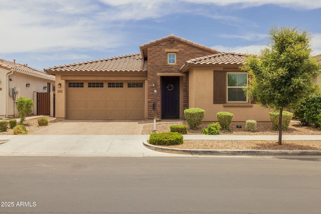 9757 E Red Giant Dr, Mesa, AZ 85212 - view of front of property featuring a tiled roof, stucco siding, an attached garage, and driveway
