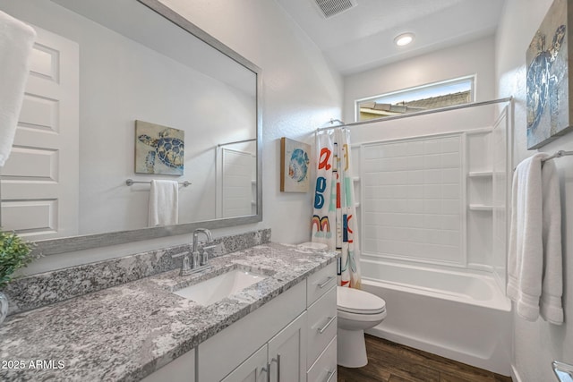 9757 E Red Giant Dr, Mesa, AZ 85212 - bathroom featuring wood finished floors, vanity, toilet, shower / bath combo with shower curtain, and recessed lighting