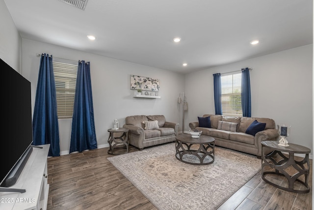 9757 E Red Giant Dr, Mesa, AZ 85212 - living area featuring dark wood-style floors, recessed lighting, and baseboards