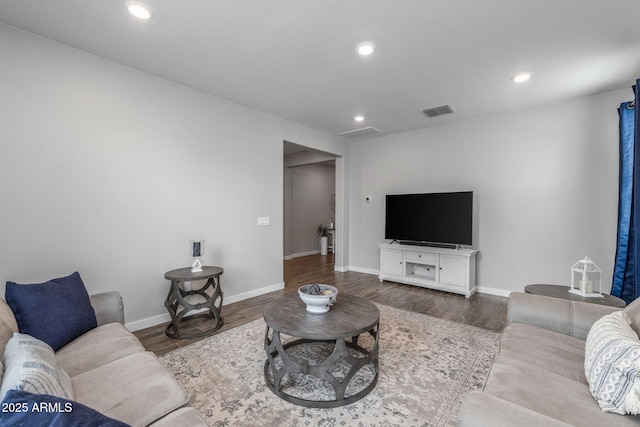9757 E Red Giant Dr, Mesa, AZ 85212 - living room featuring wood finished floors, baseboards, and recessed lighting