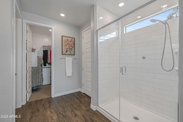 9757 E Red Giant Dr, Mesa, AZ 85212 - bathroom featuring a shower stall, wood finished floors, a spacious closet, baseboards, and recessed lighting
