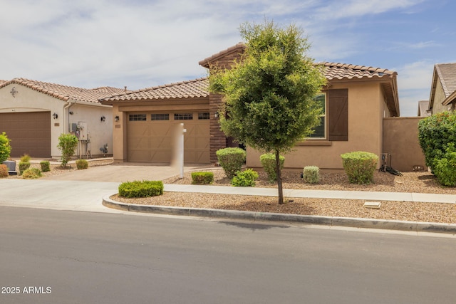 9757 E Red Giant Dr, Mesa, AZ 85212 - mediterranean / spanish home with stucco siding, a garage, a tile roof, and concrete driveway