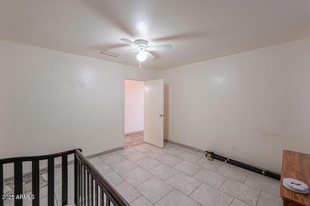 unfurnished bedroom featuring ceiling fan