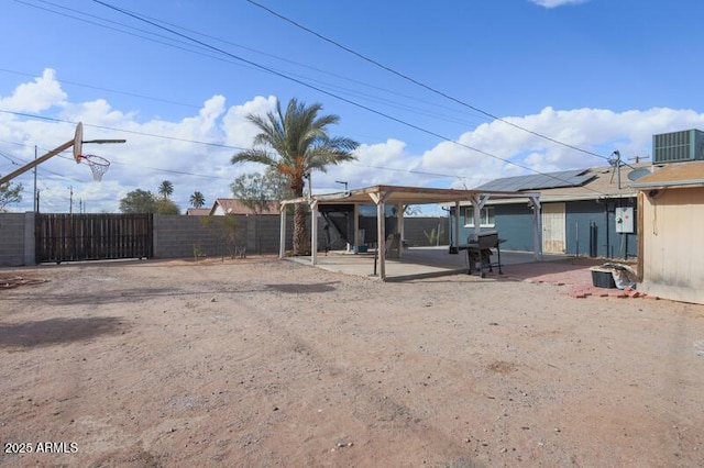 view of yard featuring cooling unit and a patio