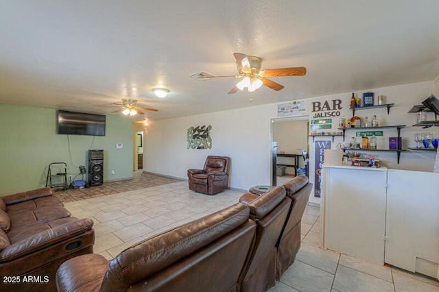 living room with light tile patterned floors and ceiling fan