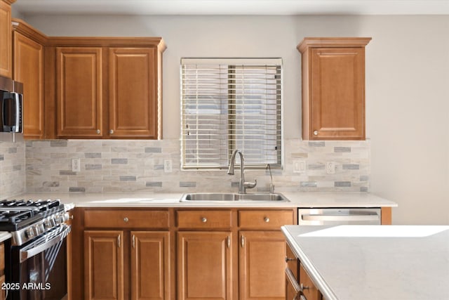 kitchen with stainless steel appliances, backsplash, and sink