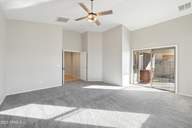 carpeted spare room featuring ceiling fan and high vaulted ceiling