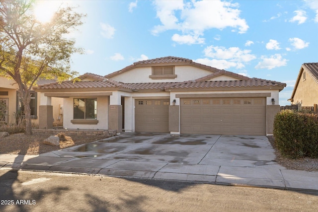 mediterranean / spanish home featuring a garage