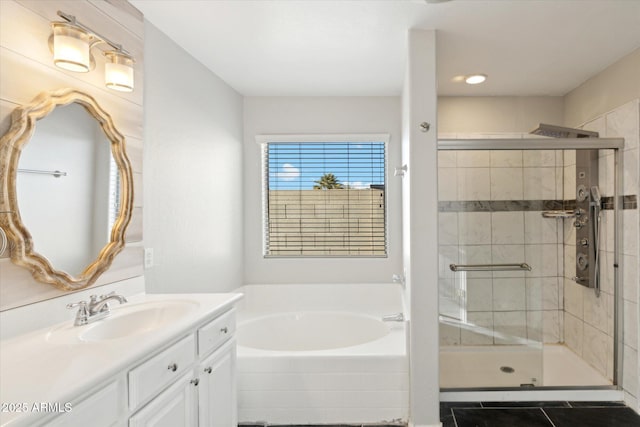 bathroom featuring vanity and independent shower and bath