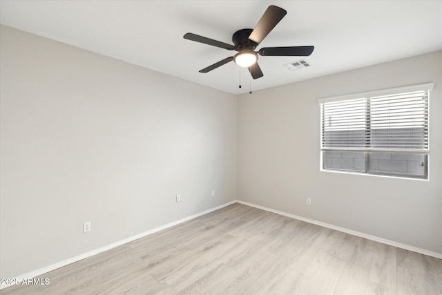 spare room featuring ceiling fan and light hardwood / wood-style floors