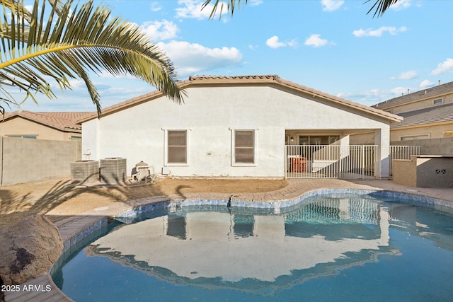 view of pool with central AC unit and a patio