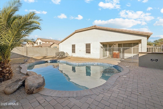 view of swimming pool with a patio area
