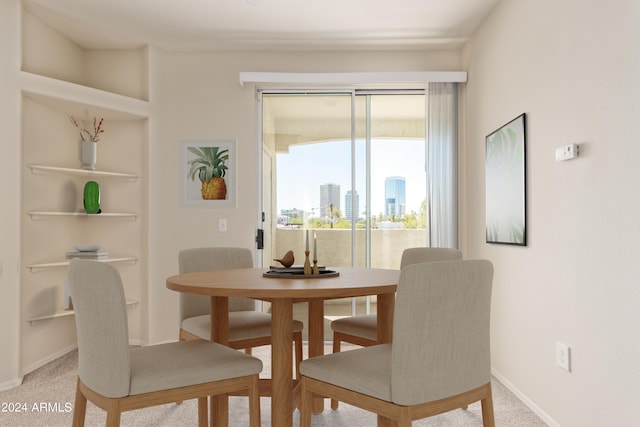 dining area featuring carpet floors and built in features