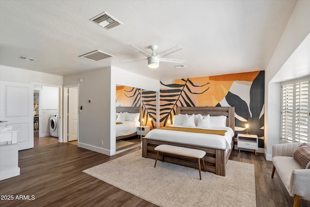 6271 E Evans Dr, Scottsdale, AZ 85254 - bedroom with visible vents, washer / clothes dryer, an accent wall, and baseboards