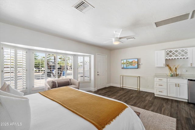 6271 E Evans Dr, Scottsdale, AZ 85254 - bedroom featuring baseboards, dark wood finished floors, and visible vents