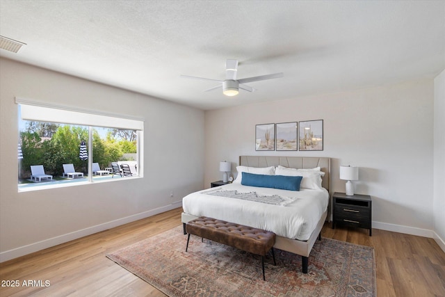 6271 E Evans Dr, Scottsdale, AZ 85254 - bedroom with visible vents, baseboards, ceiling fan, and wood finished floors