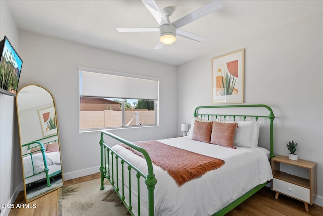 6271 E Evans Dr, Scottsdale, AZ 85254 - bedroom featuring baseboards, ceiling fan, and wood finished floors