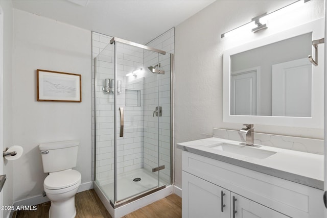 6271 E Evans Dr, Scottsdale, AZ 85254 - full bath with toilet, vanity, a stall shower, and wood finished floors