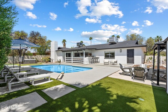 6271 E Evans Dr, Scottsdale, AZ 85254 - view of pool with a fenced in pool, fence private yard, a fire pit, cooling unit, and a patio area