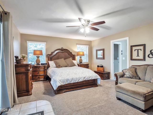 bedroom featuring light carpet and ceiling fan