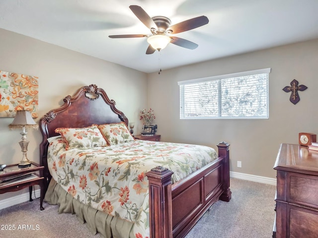 bedroom with ceiling fan and light carpet