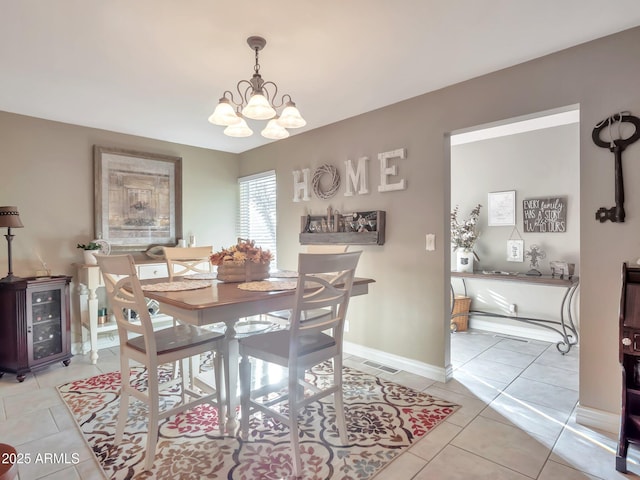 dining area with an inviting chandelier, beverage cooler, and light tile patterned flooring