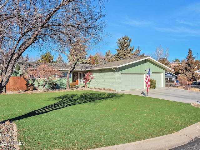 ranch-style home with a garage and a front yard