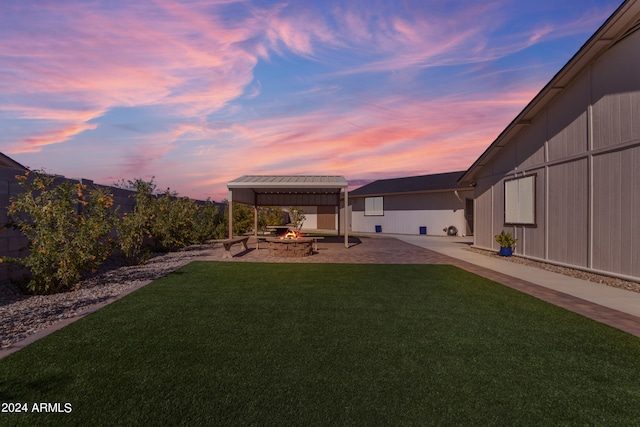 view of yard with a patio, an outdoor fire pit, a gazebo, and a fenced backyard