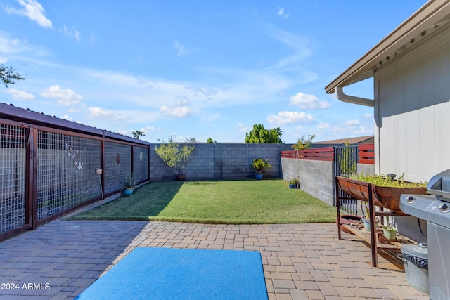 view of patio with a fenced backyard and grilling area