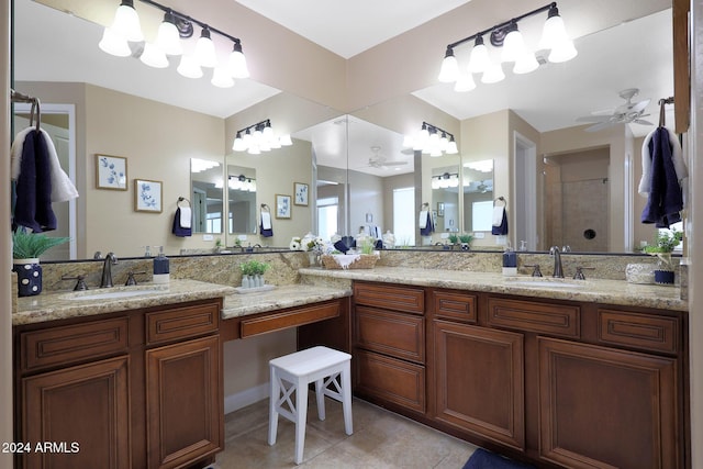 bathroom featuring tile patterned flooring, a sink, a walk in shower, and a ceiling fan