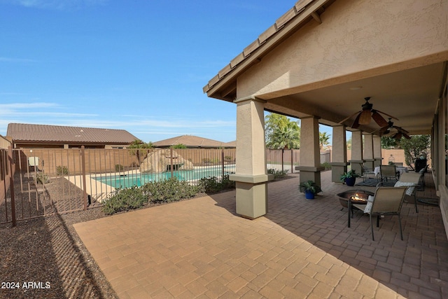 view of patio featuring a fenced backyard, a fenced in pool, and ceiling fan