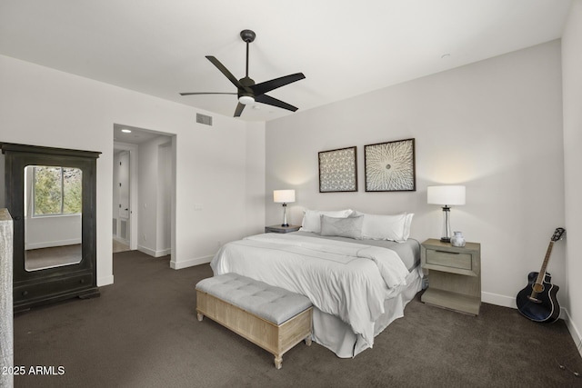 bedroom with carpet floors, visible vents, and baseboards