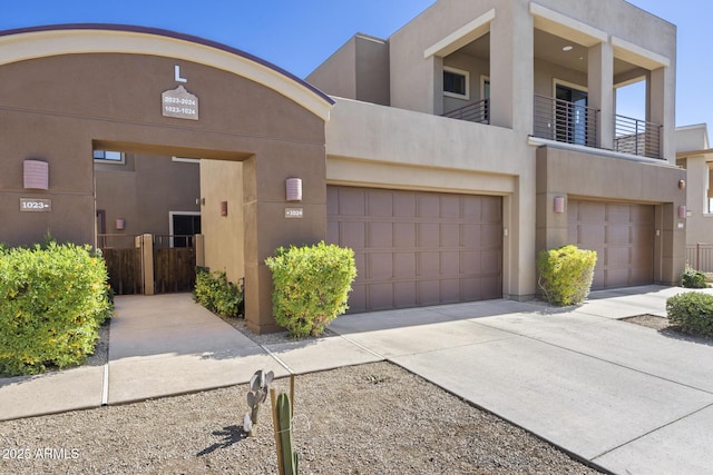 view of front of house with concrete driveway and stucco siding