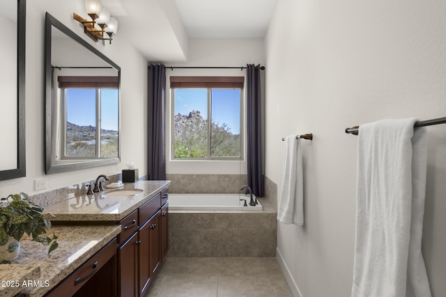 full bathroom featuring baseboards, a garden tub, vanity, and tile patterned floors