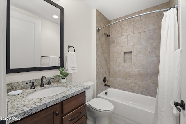 bathroom with toilet, shower / tub combo, and vanity