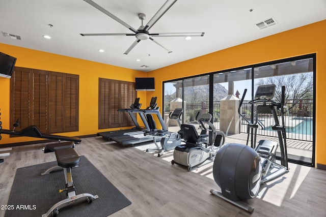 exercise room with ceiling fan, visible vents, wood finished floors, and recessed lighting