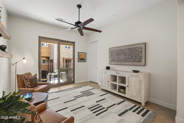 sitting room featuring ceiling fan, visible vents, and baseboards