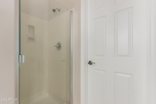 bathroom featuring a shower stall