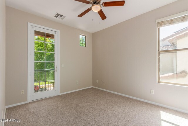 unfurnished room with carpet floors and ceiling fan