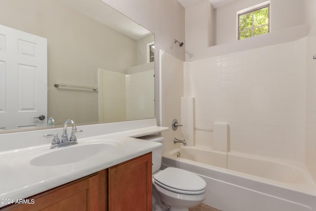 full bathroom featuring toilet, vanity, and tub / shower combination