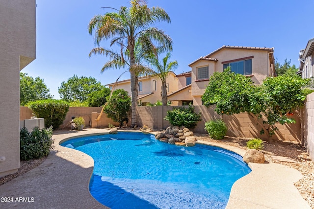 view of pool featuring a fenced in pool and a fenced backyard