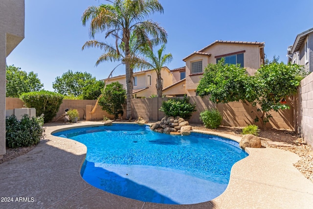 view of swimming pool with a fenced backyard and a fenced in pool